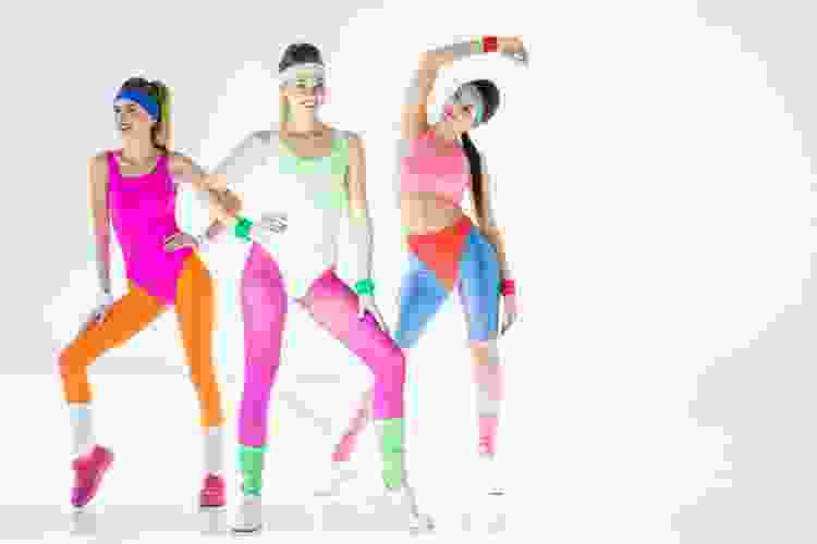 women dressed in jazzercise and aerobics 80s outfits