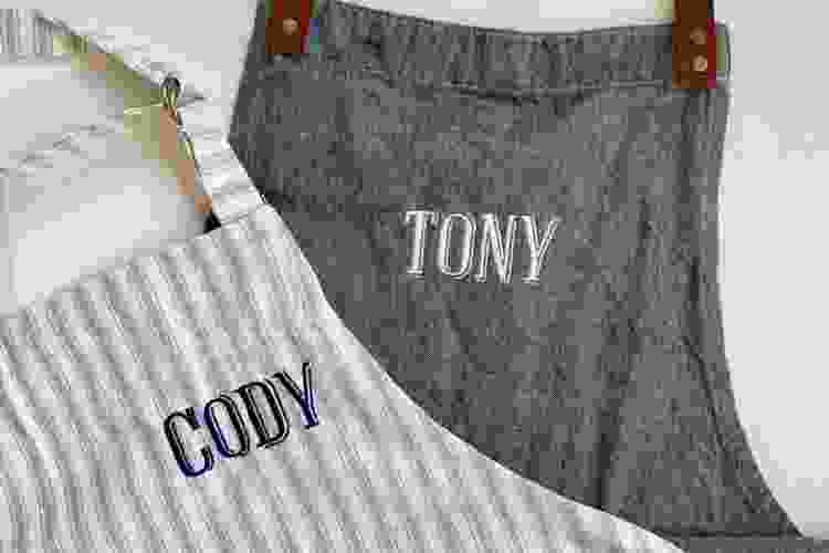 grey aprons with embroidered names