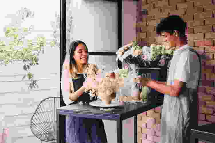 couple arranging flowers for a date jar idea