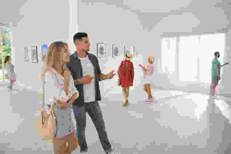 couple admiring art in gallery