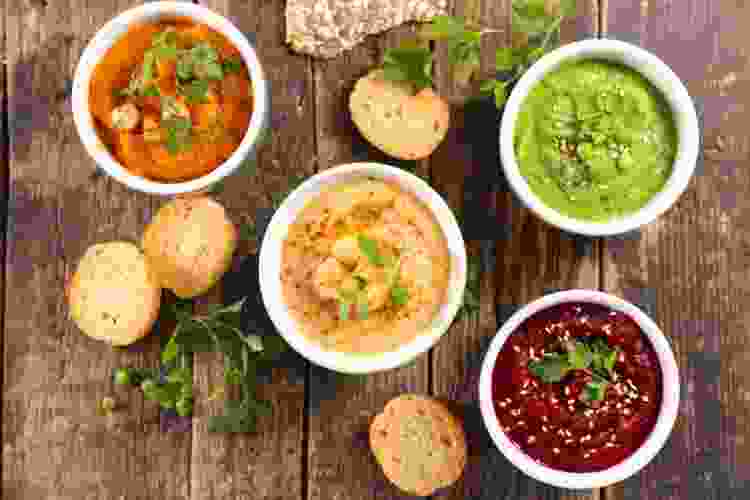 assorted dips and spreads in bowls