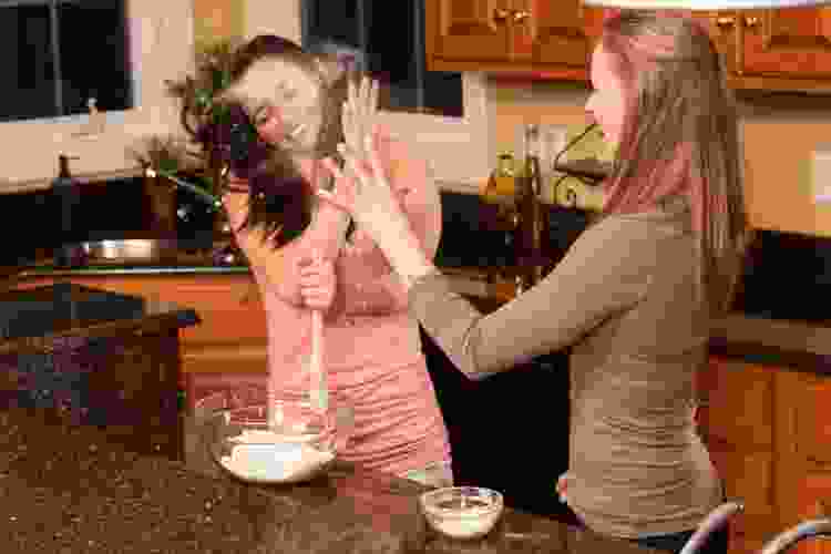 two teens girls baking together