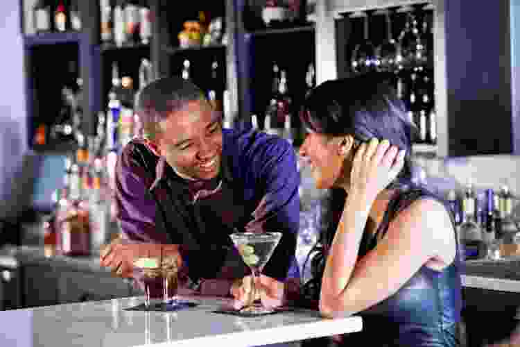 couple drinking in a dive bar