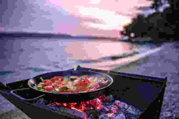 cooking over fire on the beach