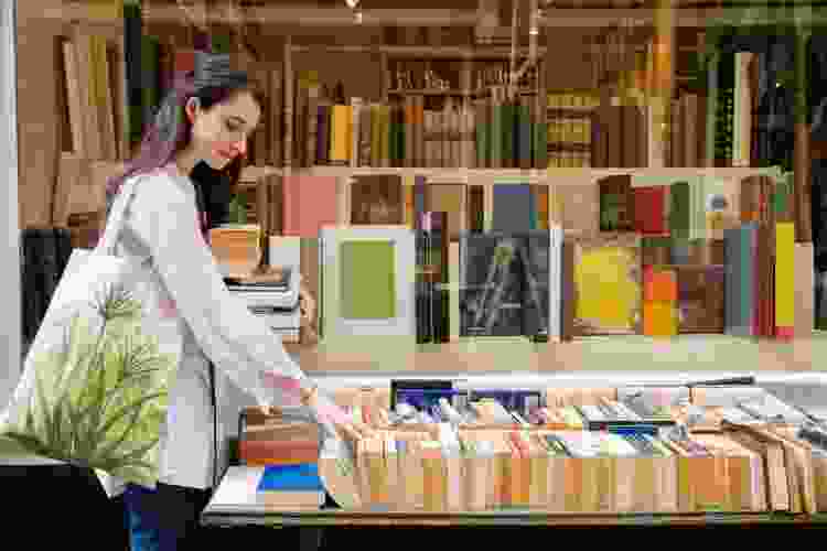 woman perusing stands at the bookstore