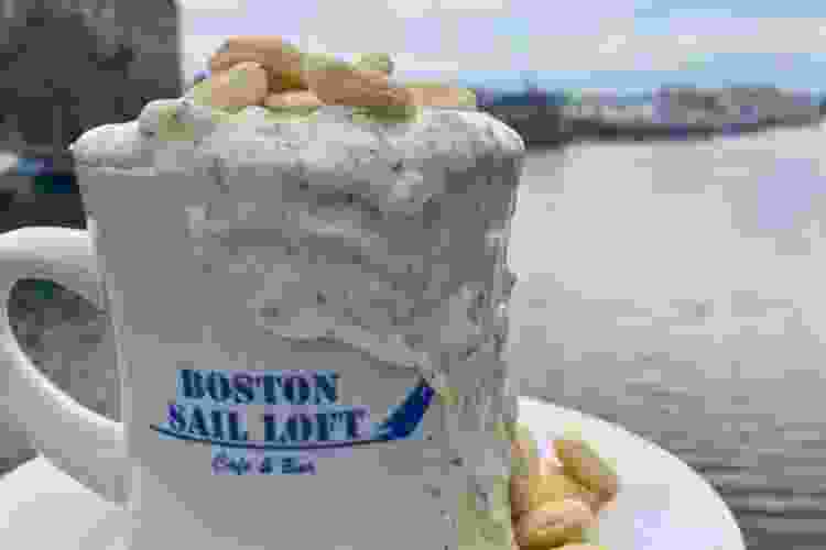 Boston Sail Loft mug filled with seafood chowder and oyster crackers Boston food