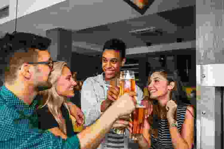 friends drinking beer in brewery