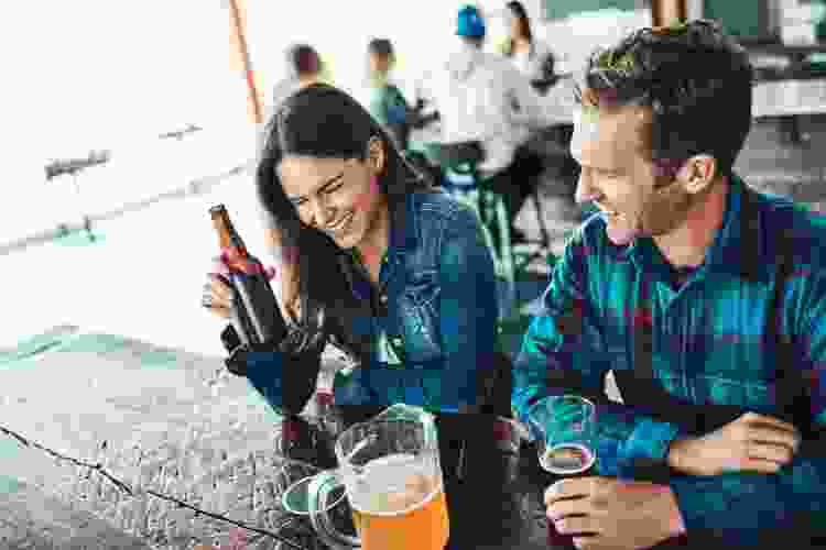 couple on date drinking beer at brewery