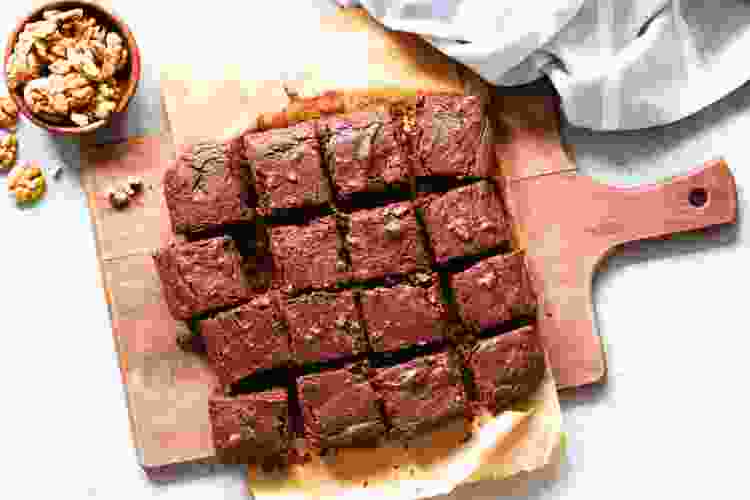 cutting board with sliced brownies 