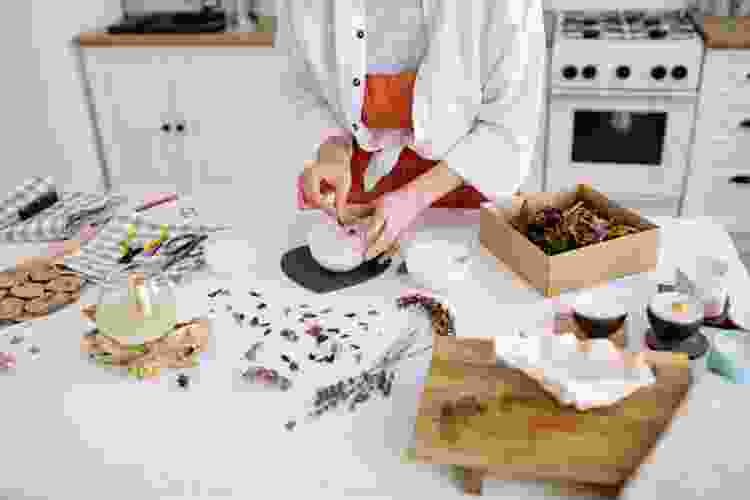 candle making supplies on a counter, including scents and wax