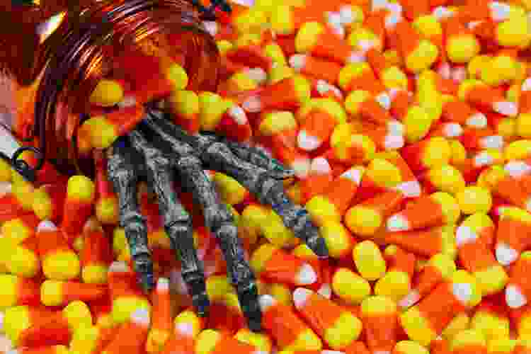 skeleton hand reaching for candy corn