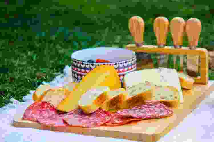 charcuterie board on picnic blanket