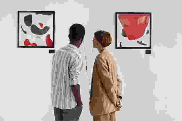 couple viewing art in gallery