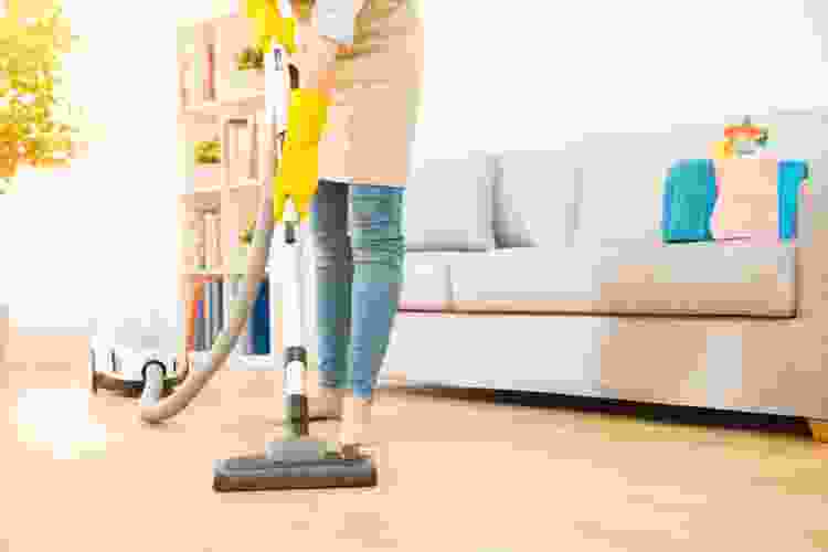 woman vacuuming living room