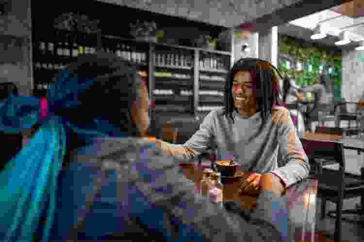 couple drinking coffee in café