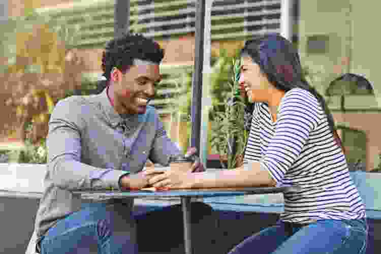 couple drinking coffee on café terrace