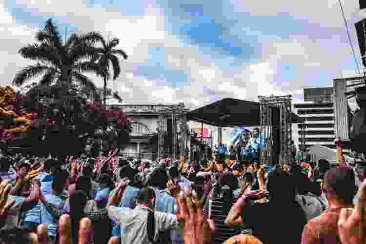 crowd attending concert during the day