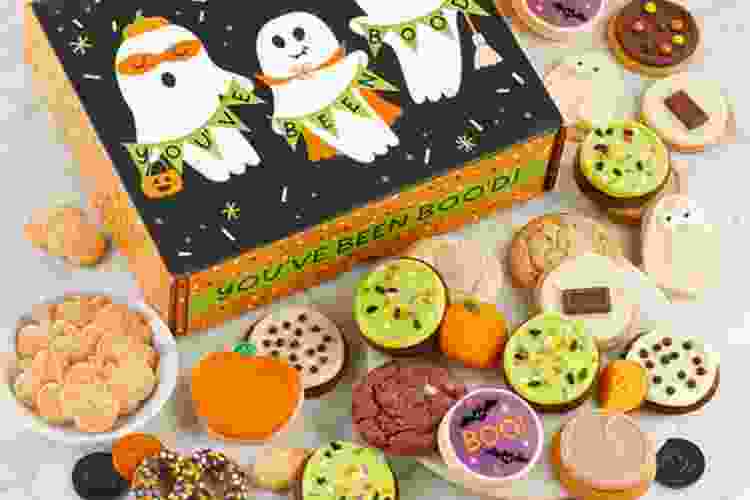 Halloween gift box with cute happy ghosts surrounded by tons of Halloween-themed cookies