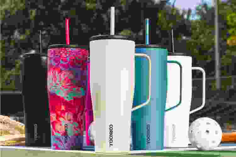 colorful Corkcicle tumblers in a row