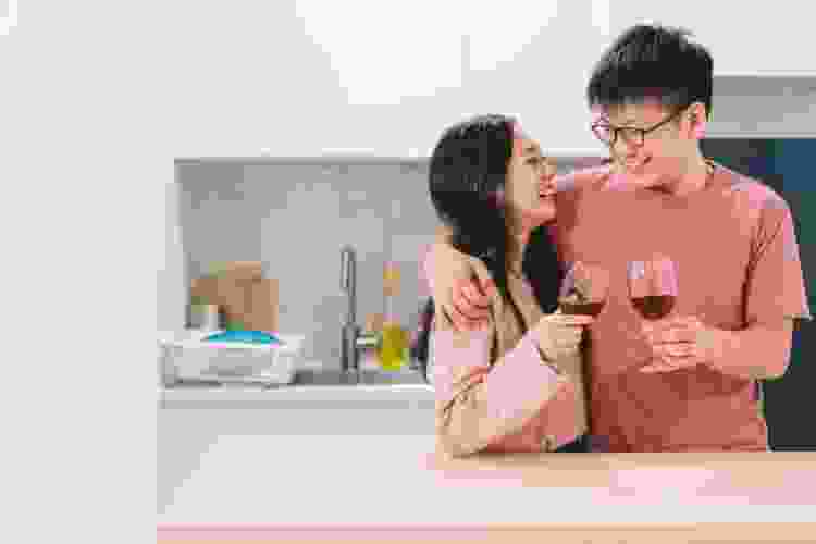 couple drinking wine together at home