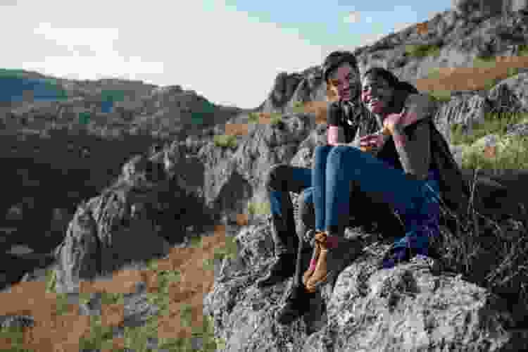 couple enjoying mountain views at the end of a hike