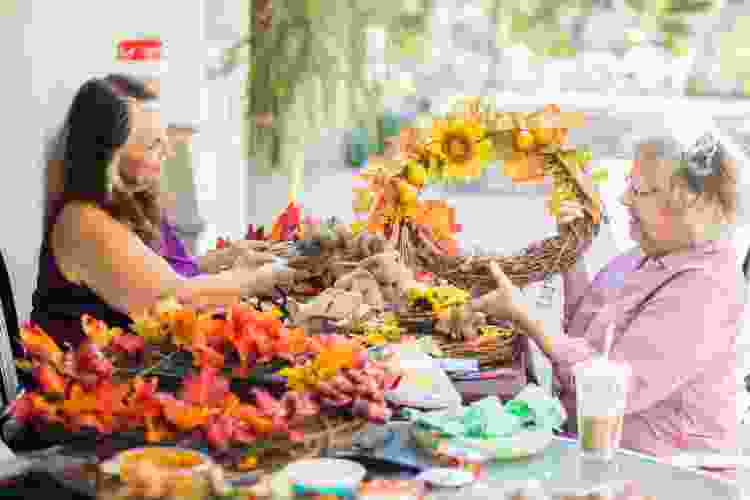 women making fall wreaths