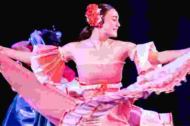 cumbia dancer in pink cumbia attire