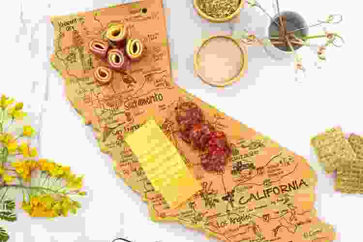 charcuterie on cutting board shaped like California