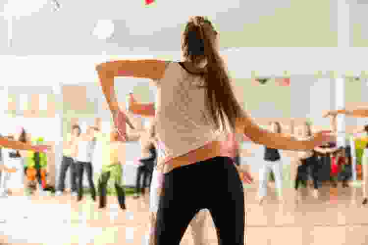 young woman dancing in dance studio