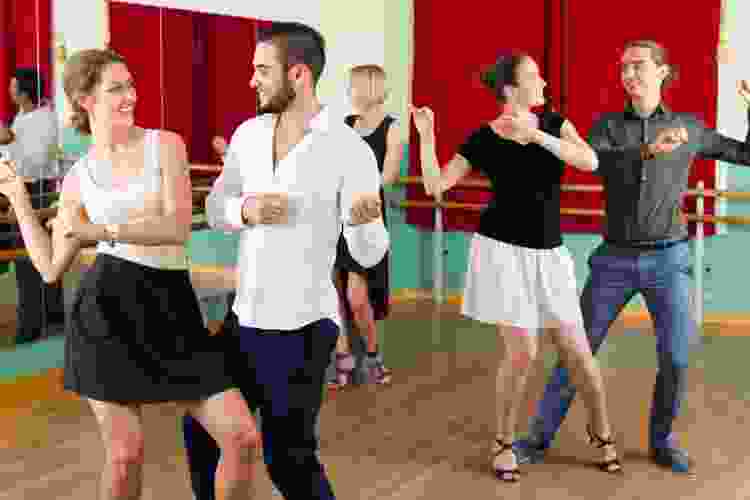 dancers learning new moves in class