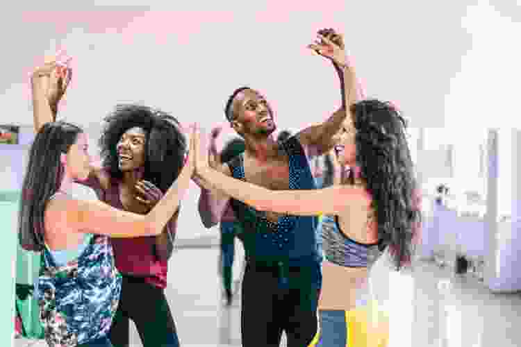 group of friends dancing in dance studio