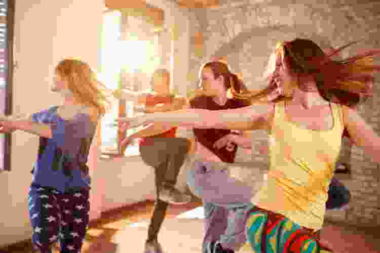 group of dancers dancing in studio