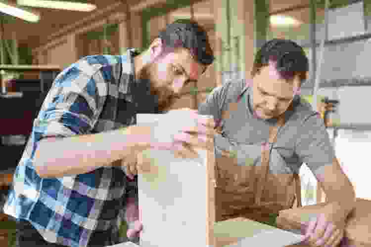 two men working in woodshop