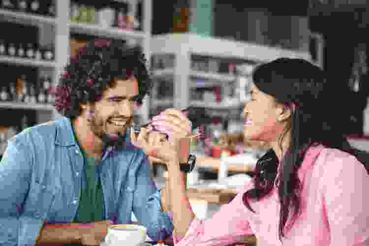 couple eating dessert together at coffee shop