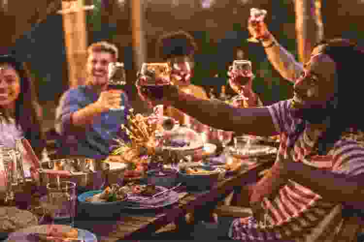 friends cheers at dinner party