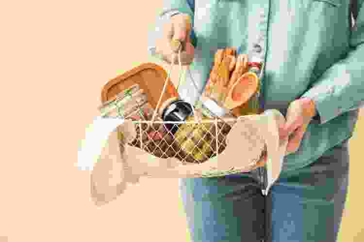 DIY self-care gift basket with breadsticks and kitchen utensils