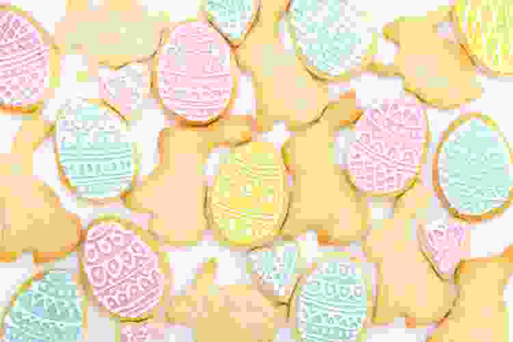 bunny and egg shaped cookies with pink and yellow frosting