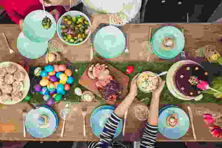 Easter tablescape with dyed eggs, faux grass and tulips