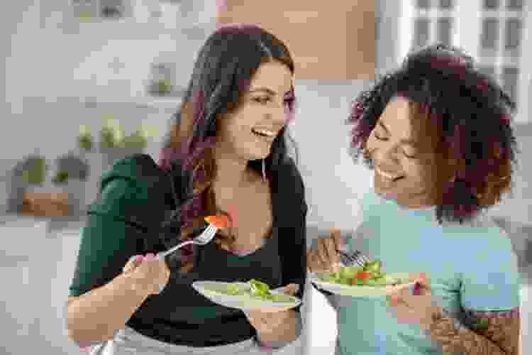 women eating salad together