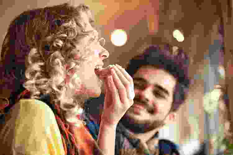 couple eating toast in restaurant