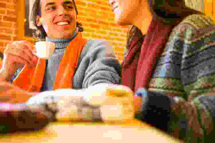 couple drinking espresso in coffee shop