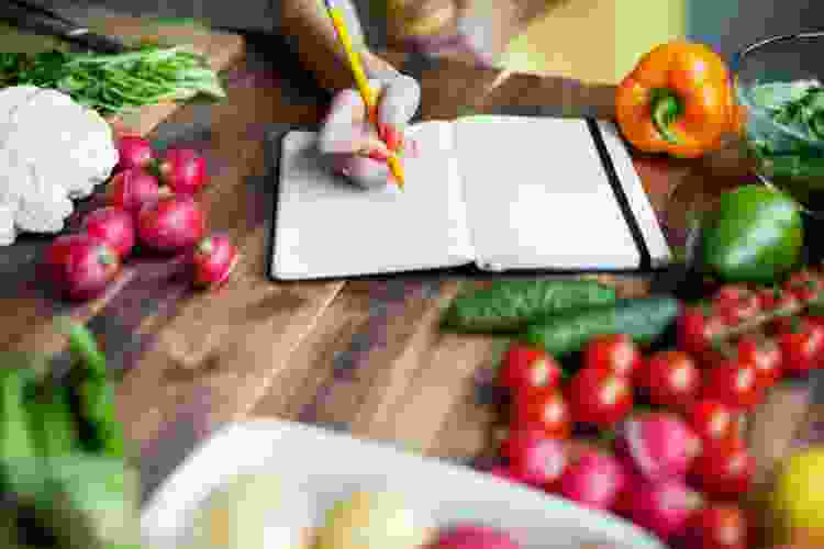 handwriting recipes into family cookbook