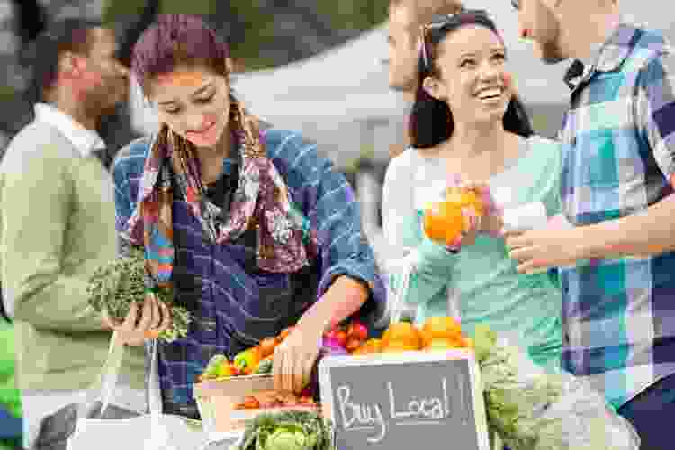 people shopping for produce at farmers market