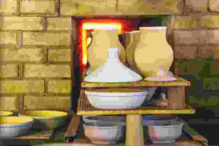 pottery making firing clay pots in kiln