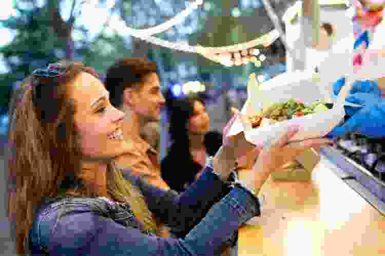 couple ordering street food at food truck