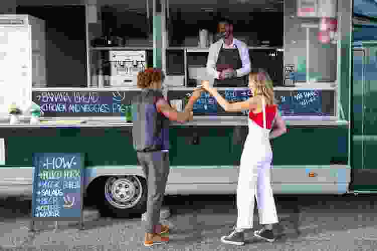 couple ordering food at food truck