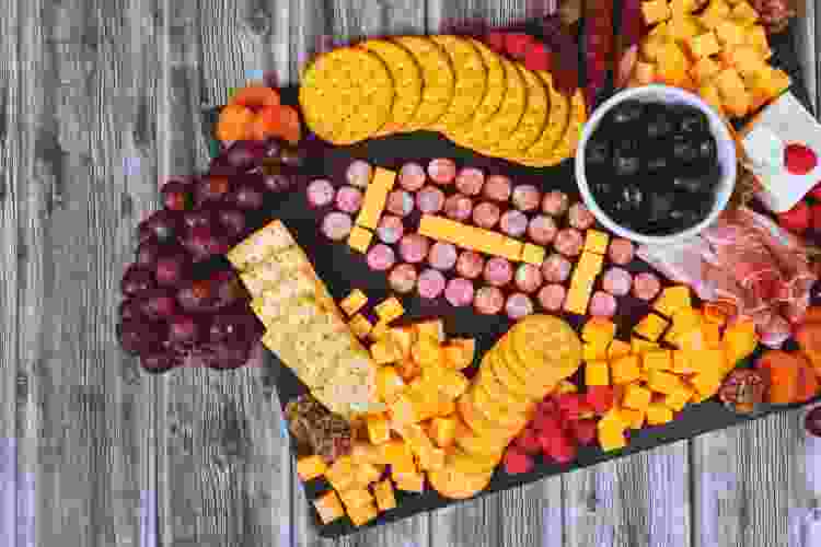 charcuterie board with meat shaped like football