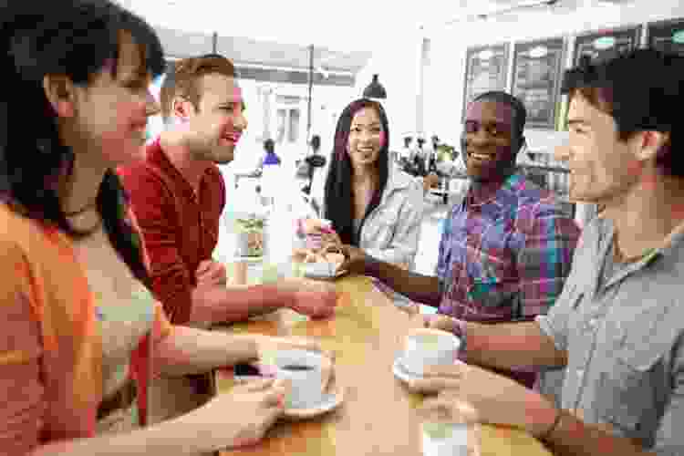 group of friends drinking coffee in a coffee shop