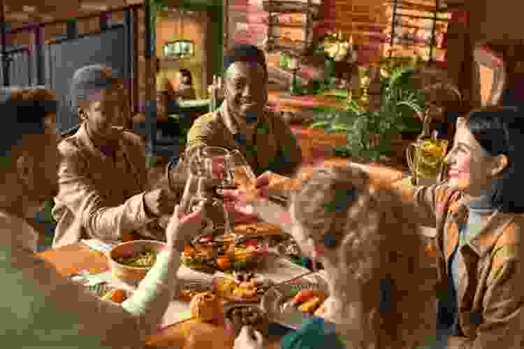 group of friends sharing thanksgiving dinner