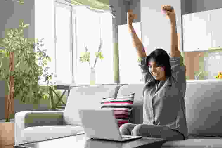 woman celebrating win in online game